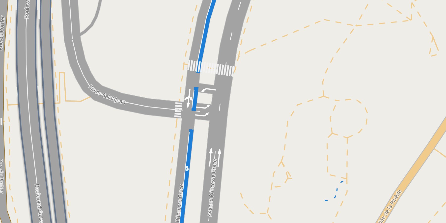 A lanestyle map of Monaco: Avenue Princesse Grace with its bike lane in blue, turn arrows before the junction, lane lines and zebra crossings
